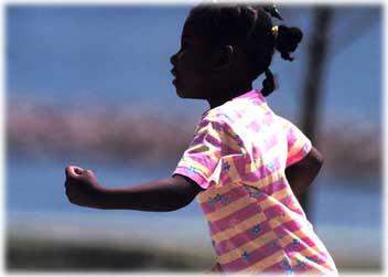 A Girl Running on the Beach